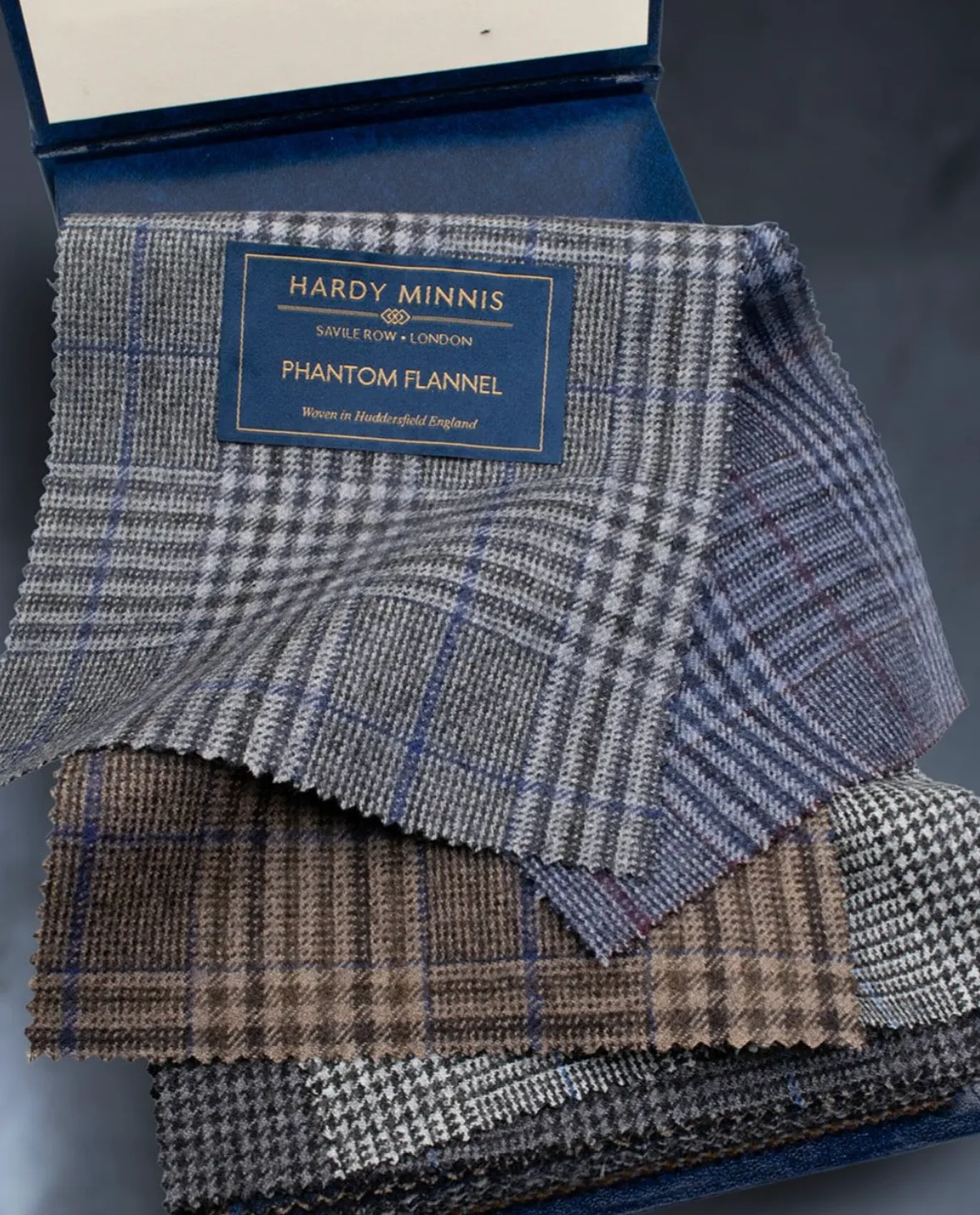 Hardy Minnis Phantom Flannel wool fabric swatches in Prince of Wales check and herringbone patterns for winter sport jackets
