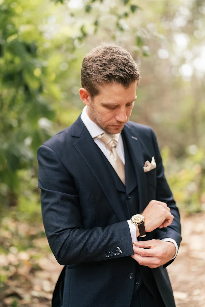 Navy three-piece suit with white shirt and champagne tie showing a neutral tie and shirt combination by Bespoke By CB