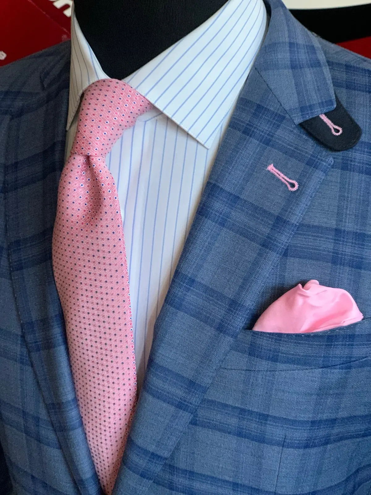Custom blue plaid sport coat with pink pocket square and tie from Bespoke By CB Miami
