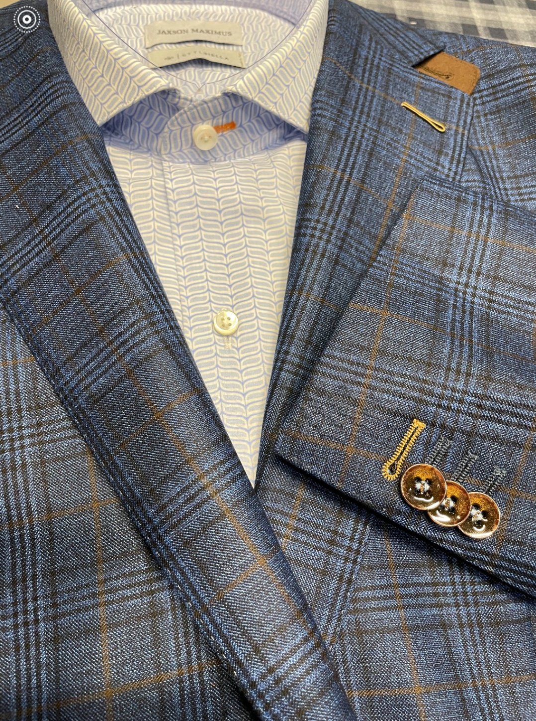 Custom dress shirts in various colors and patterns