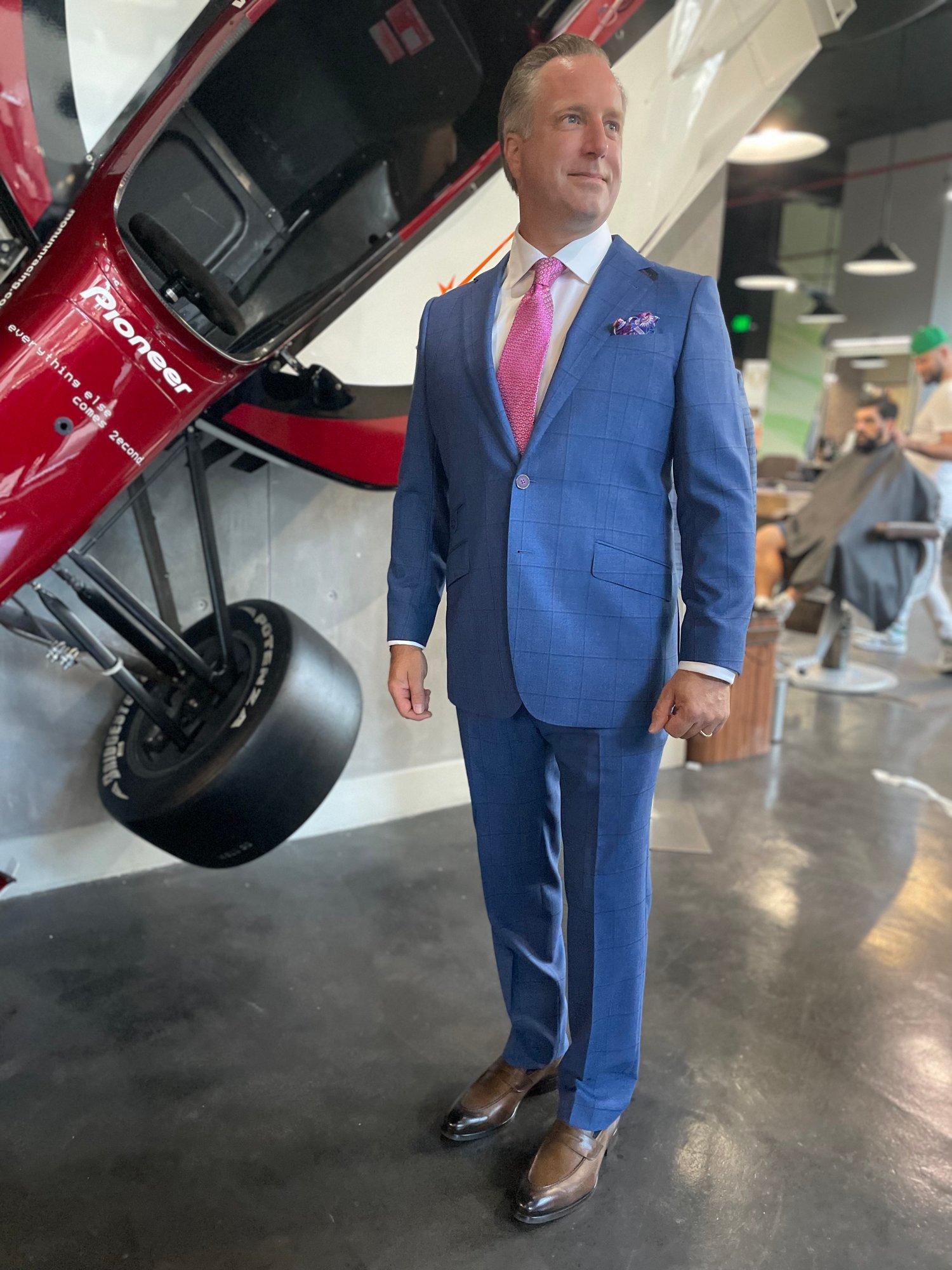 Close-up of a light blue custom suit fabric with subtle texture