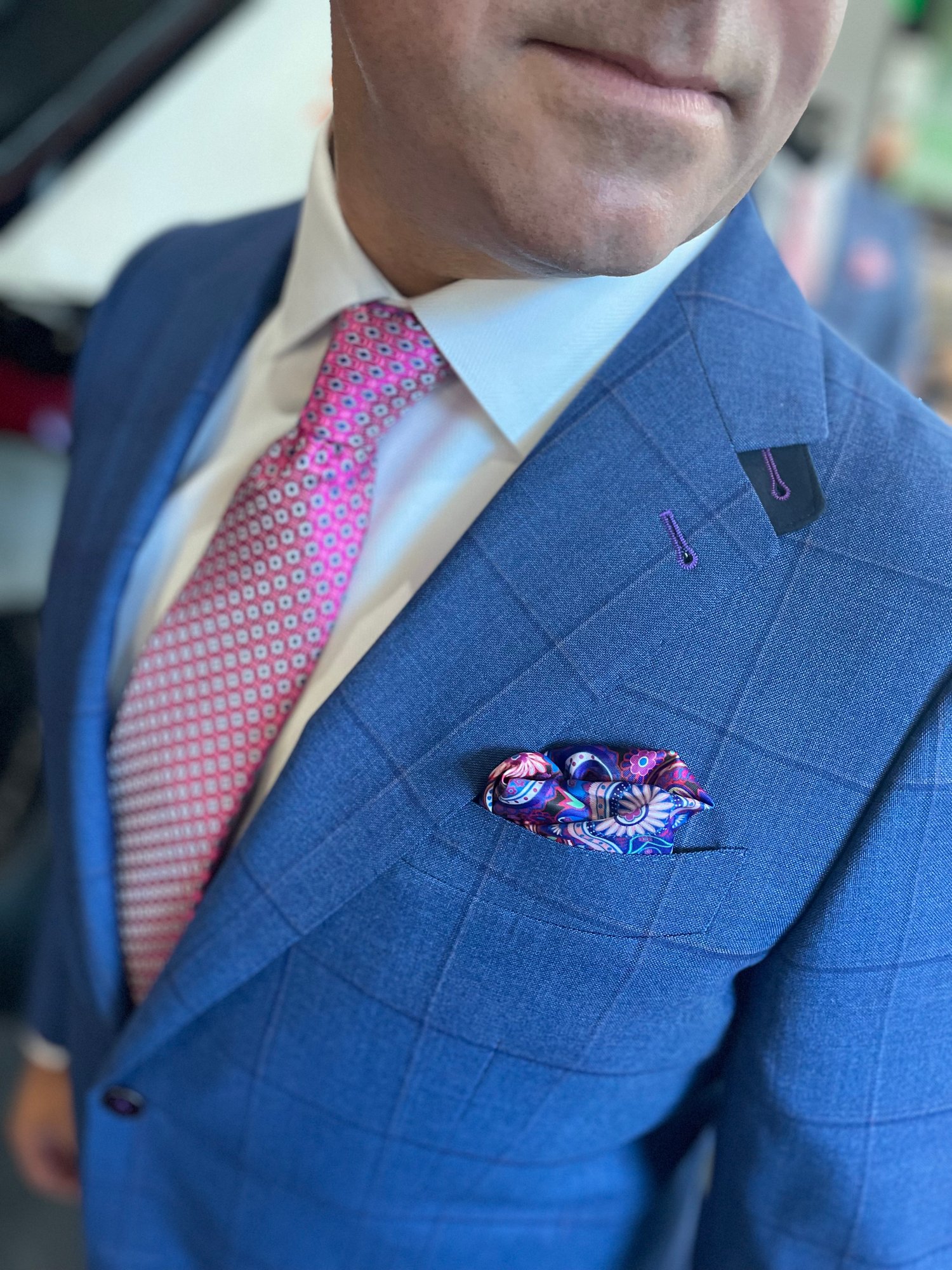 Custom suit fabric close-up showing performance features for active wear