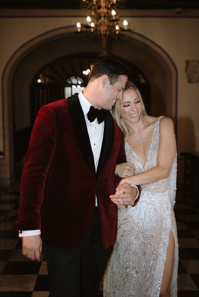 Velvet dinner jacket styled with black tuxedo trousers for a black tie gala