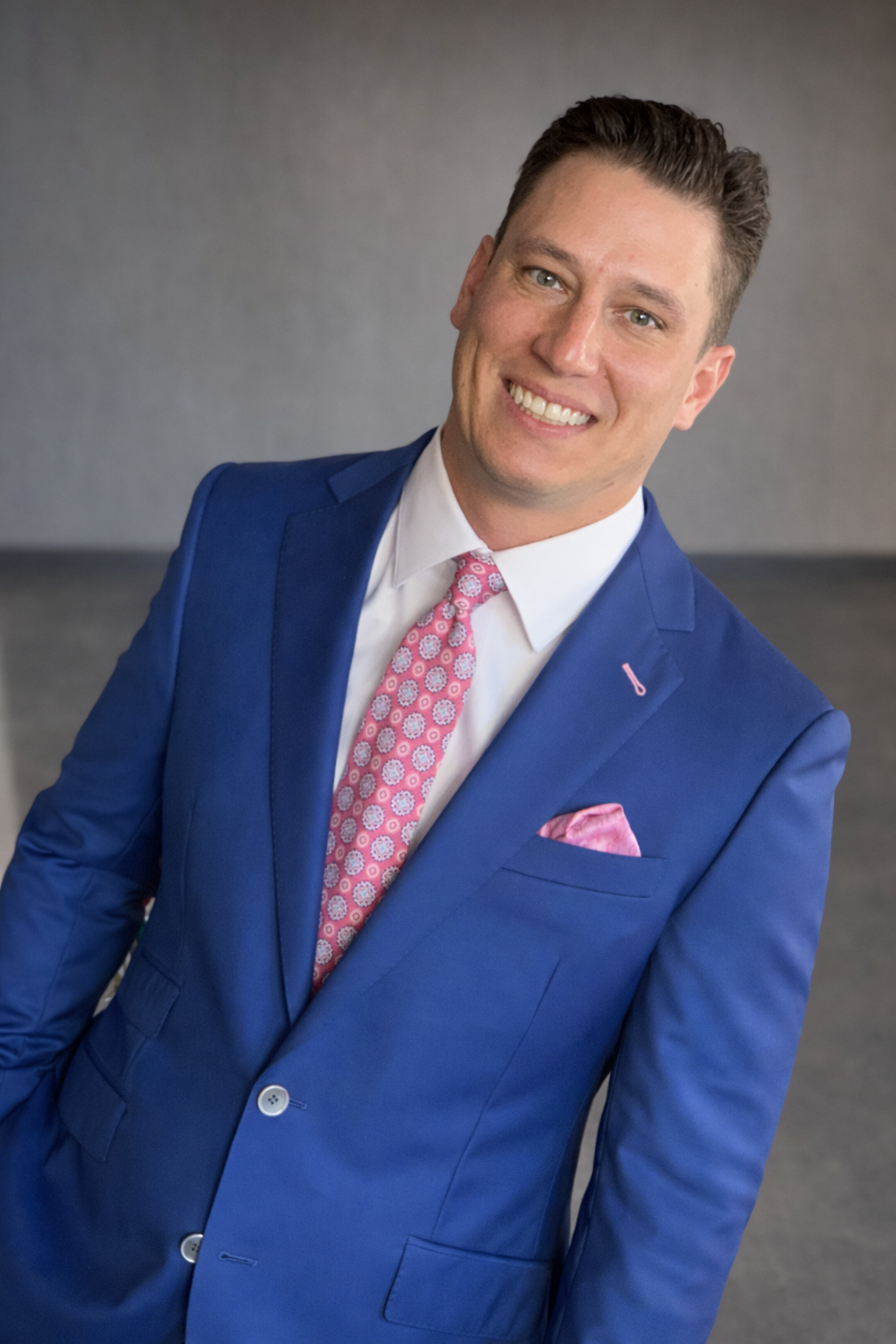 Different pocket square fold styles displayed on custom suit jackets at Bespoke By CB