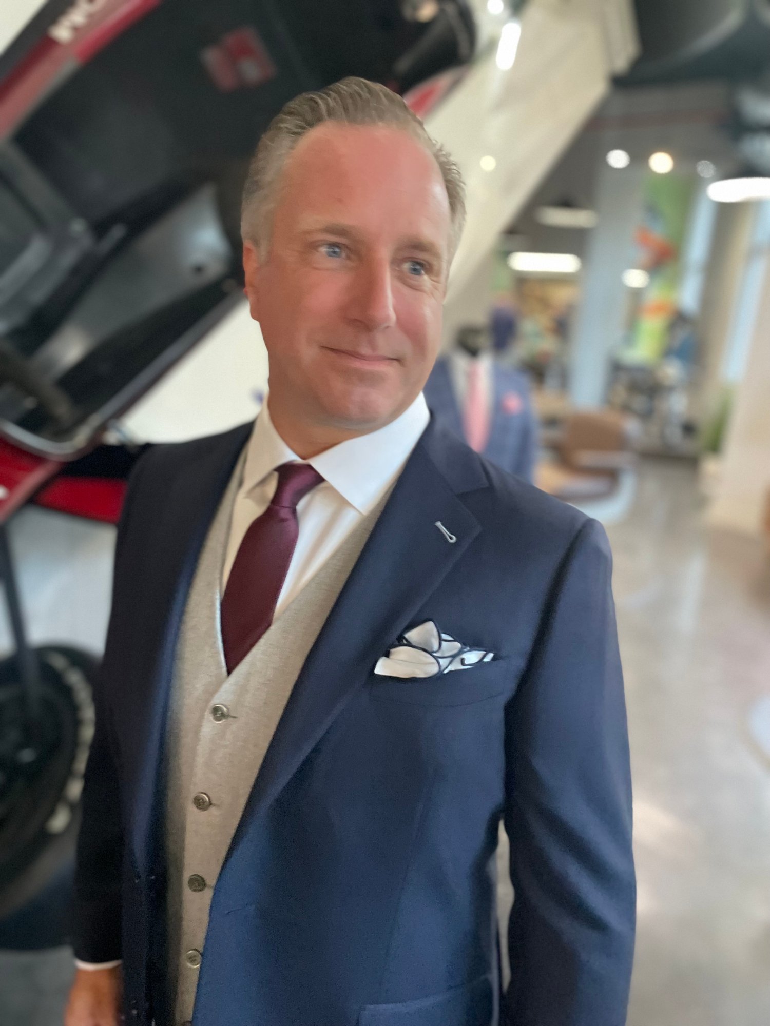 Christian Boehm of Bespoke By CB fitting a custom suit for a corporate executive