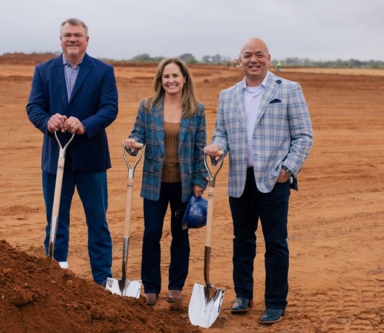Man wearing a charcoal grey suit at a professional business meeting in Miami