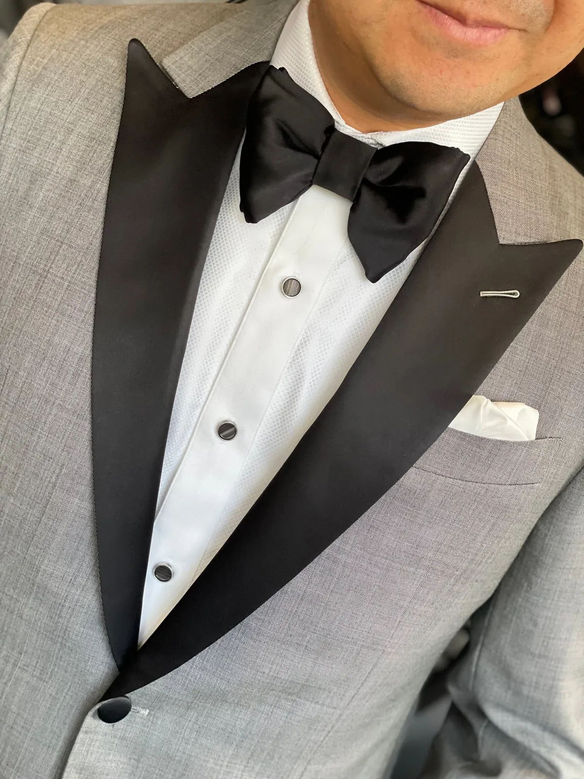 Grey custom tuxedo with formal shirt studs crafted by Bespoke By CB for black tie events