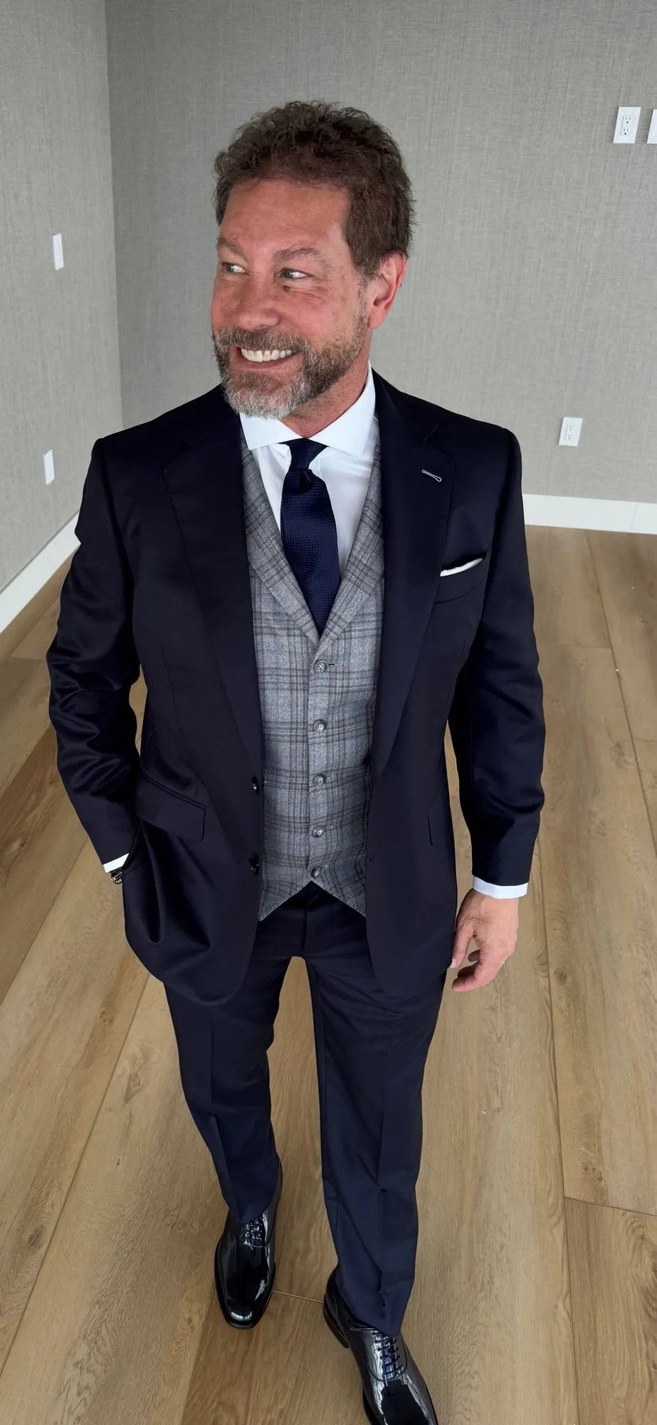 Custom three-piece suit fitting at Bespoke By CB showing tailored fit on client