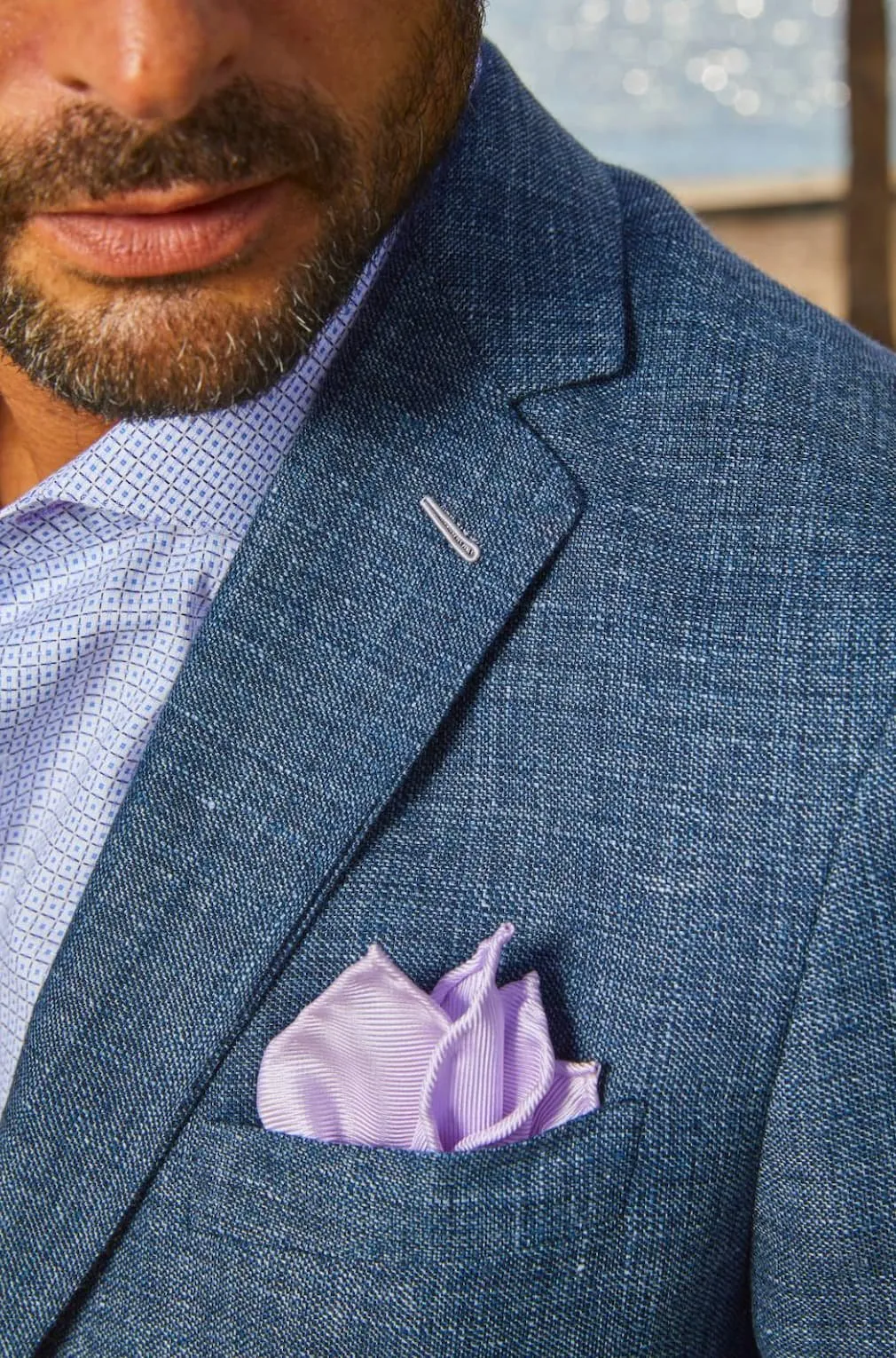Bespoke By CB in-office suit consultation showing fabric options for professionals