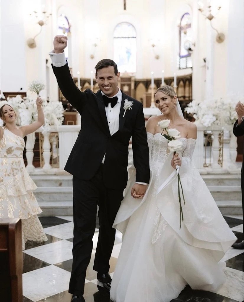 Groom in a custom navy suit at a Coral Gables wedding venue