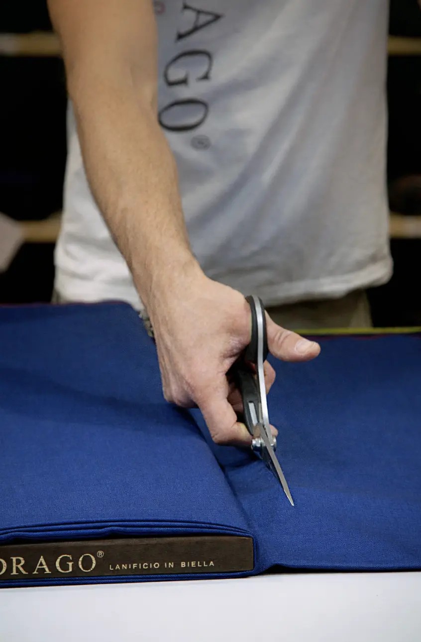 Drago fabric swatch bunch cards showing range of blue wool fabrics for custom suit selection at Bespoke By CB