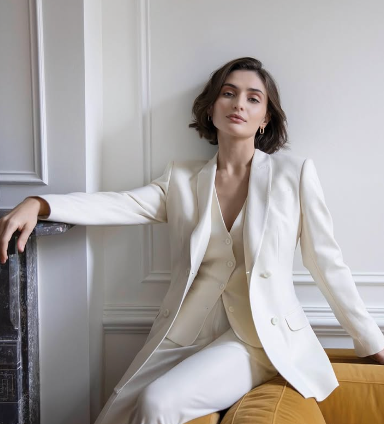 Woman in cream three-piece suit, custom tailored pants styling by Bespoke By CB