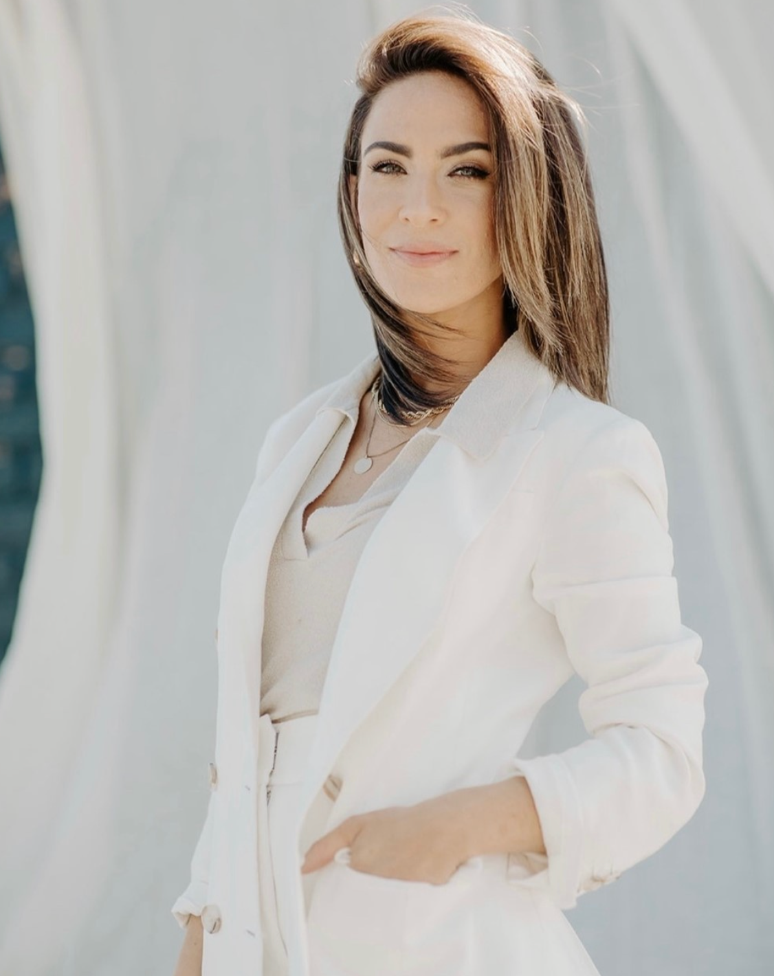 Woman in white blazer over beige top, custom white suit styling by Bespoke By CB