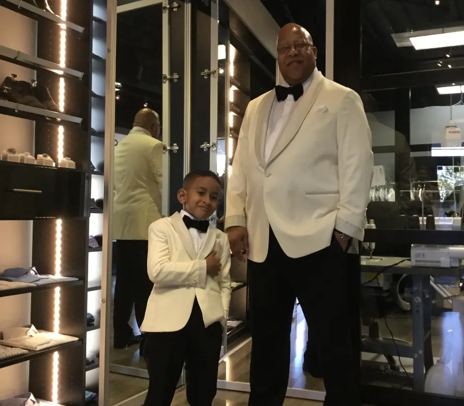 Custom clothing consultation for plus-size men at Bespoke By CB Miami, discussing fit and fabric options