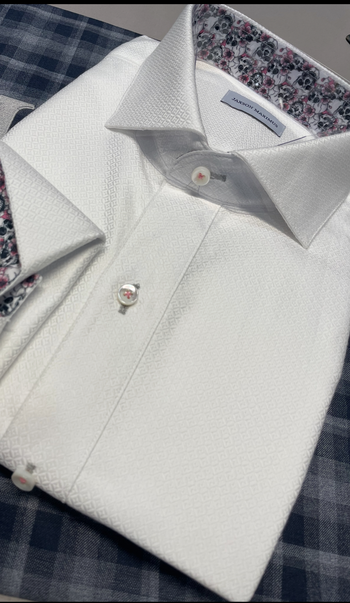 Detail of a textured dress shirt with a pocket square, showing how accessories elevate a Coral Gables wedding outfit