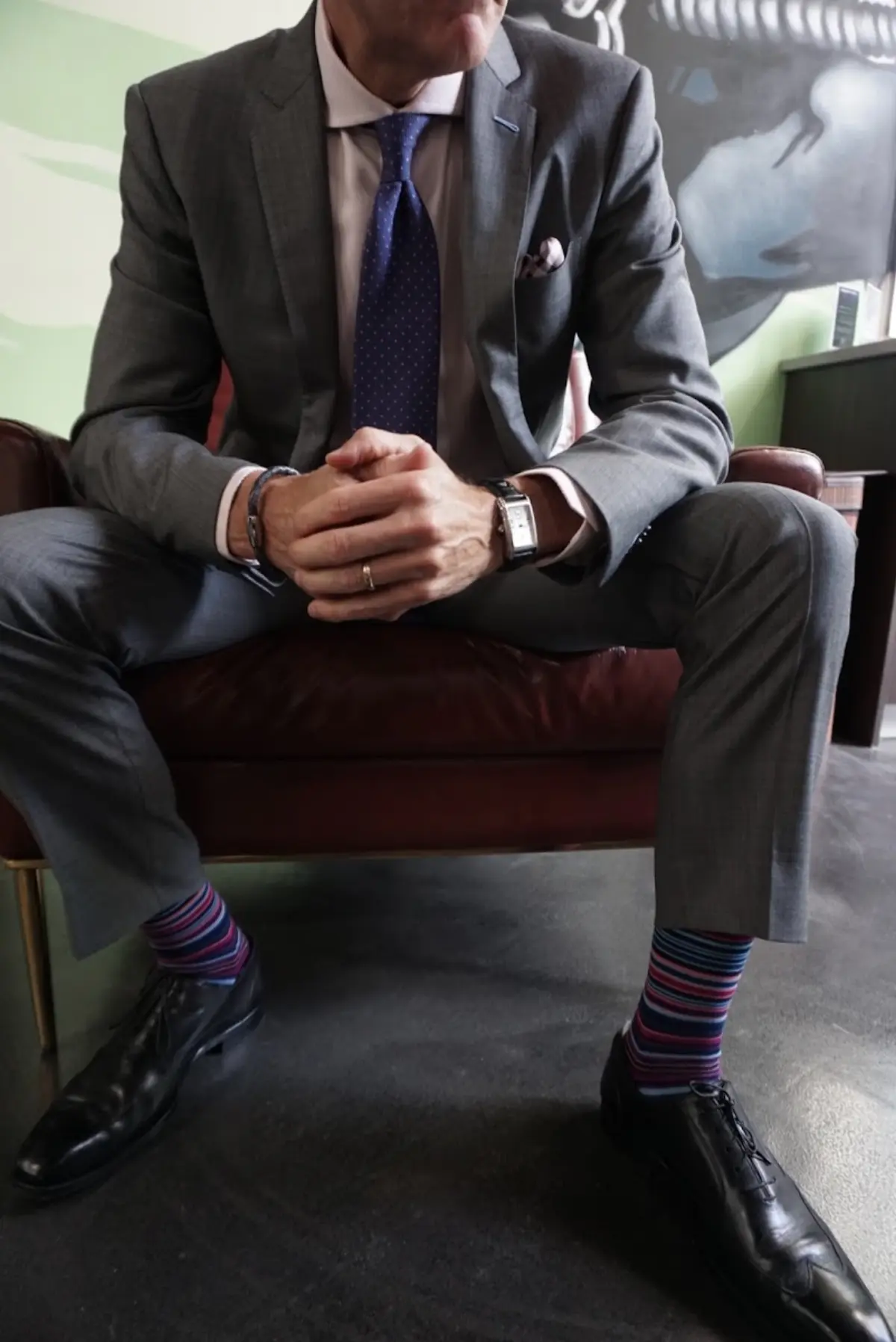 A grey polished suit ensemble shows the refined result of premium fabric selection at a Miami custom clothier