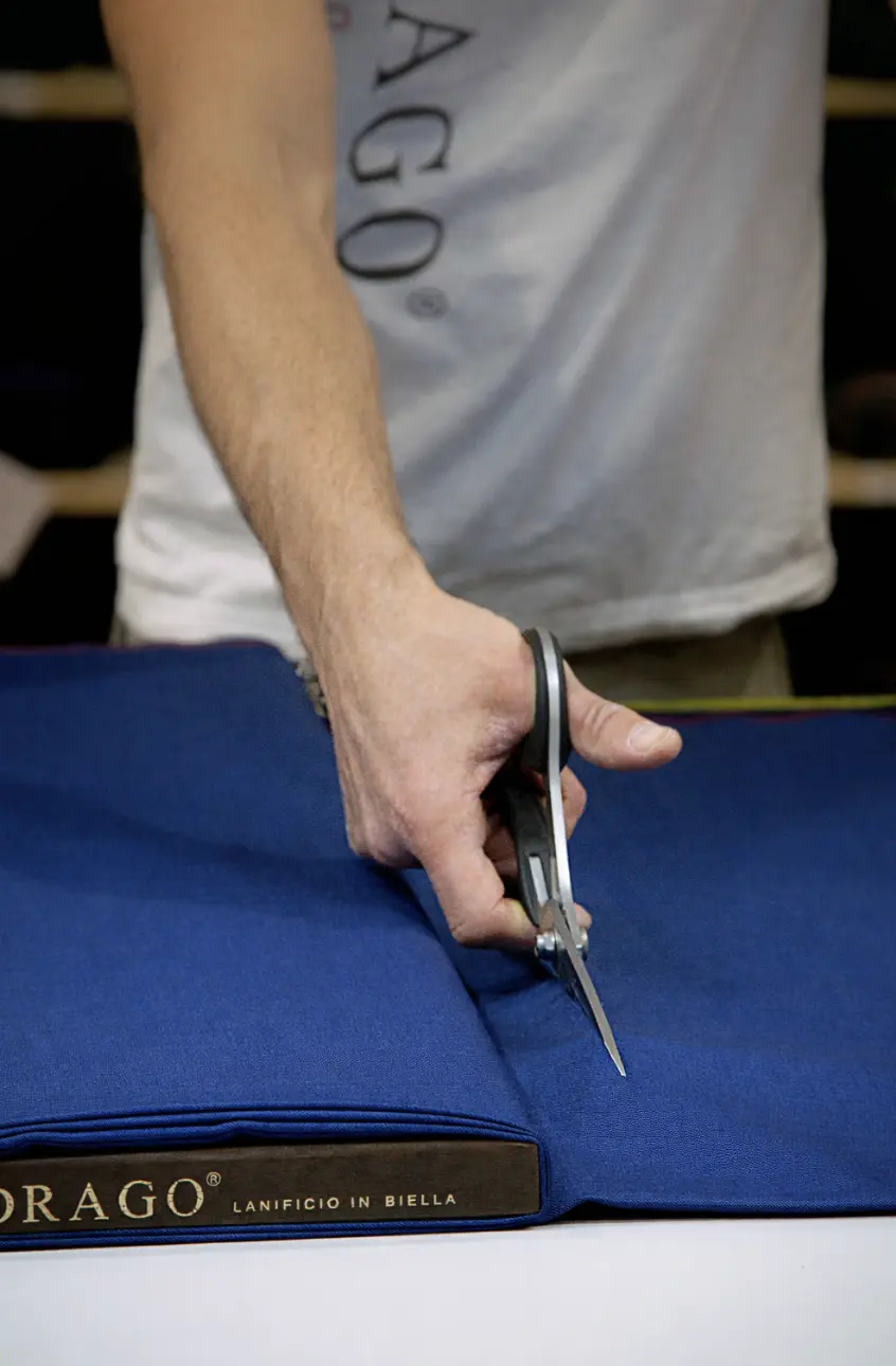 Drago fabric swatch bunch cards showing range of blue wool fabrics for custom suit selection at Bespoke By CB