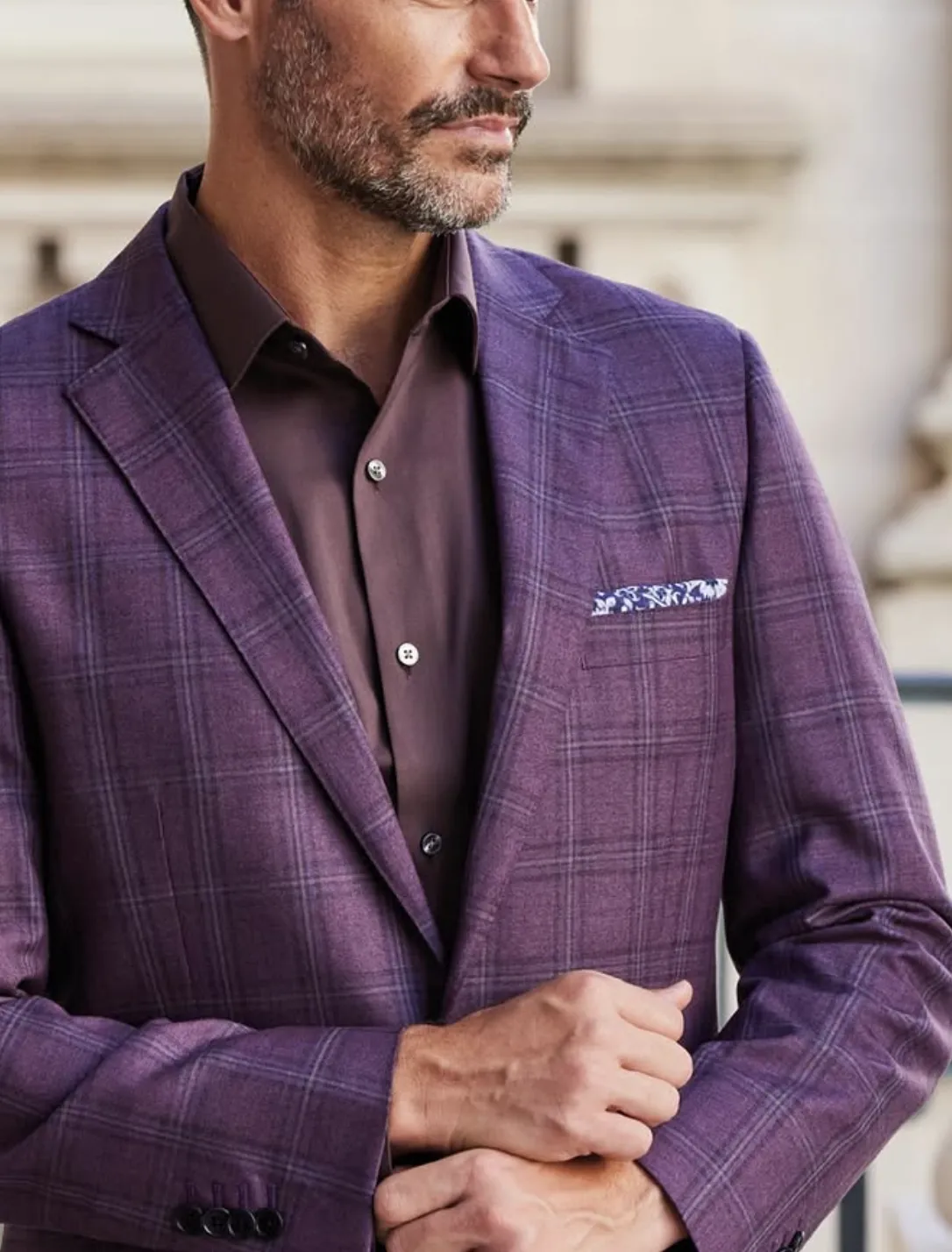 Close-up of purple plaid Gladson Bamboo III sport coat showing windowpane pattern, notch lapel, and pocket square detail