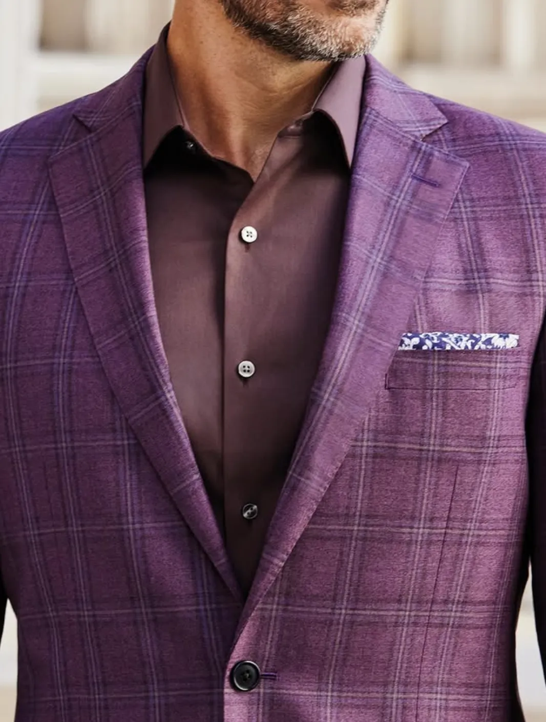 Detail of Gladson Bamboo III fabric showing plum windowpane plaid weave, button cuffs, and collar construction on custom sport coat