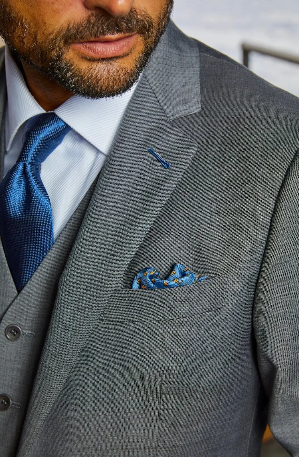 Custom three-piece charcoal suit with vest at Bespoke By CB