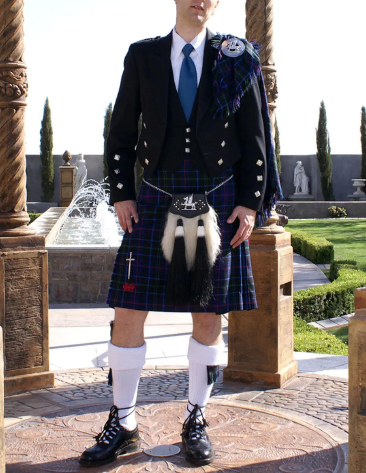 Custom kilt construction showing hand-stitched pleats and traditional hardware