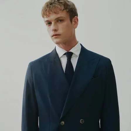 Navy double-breasted blazer with white shirt and tie, a versatile business casual look from Bespoke By CB