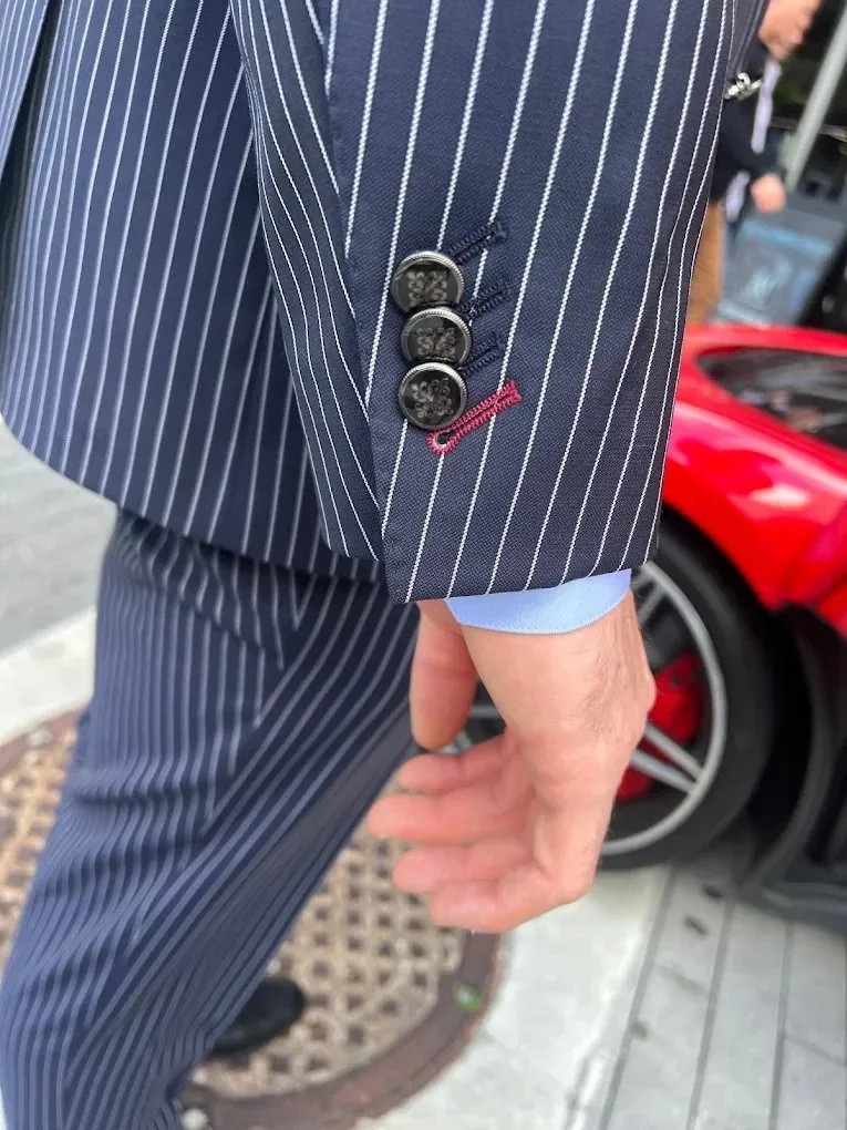 A vintage-inspired pinstripe suit with retro styling details, demonstrating how classic tailoring elements remain timeless in modern custom menswear by Bespoke By CB.