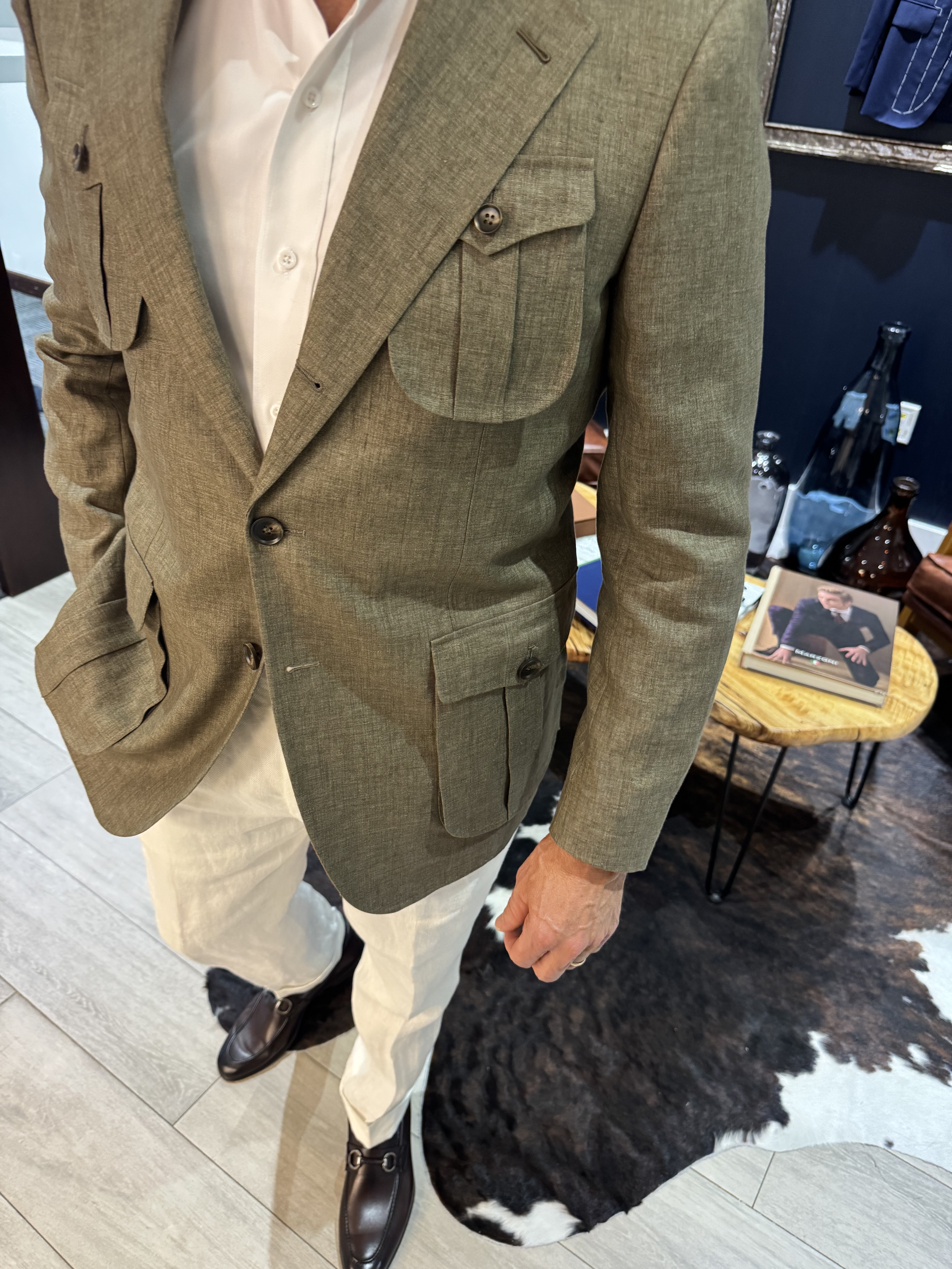 Close up of safari jacket showing bellows pocket detail and pleated flap