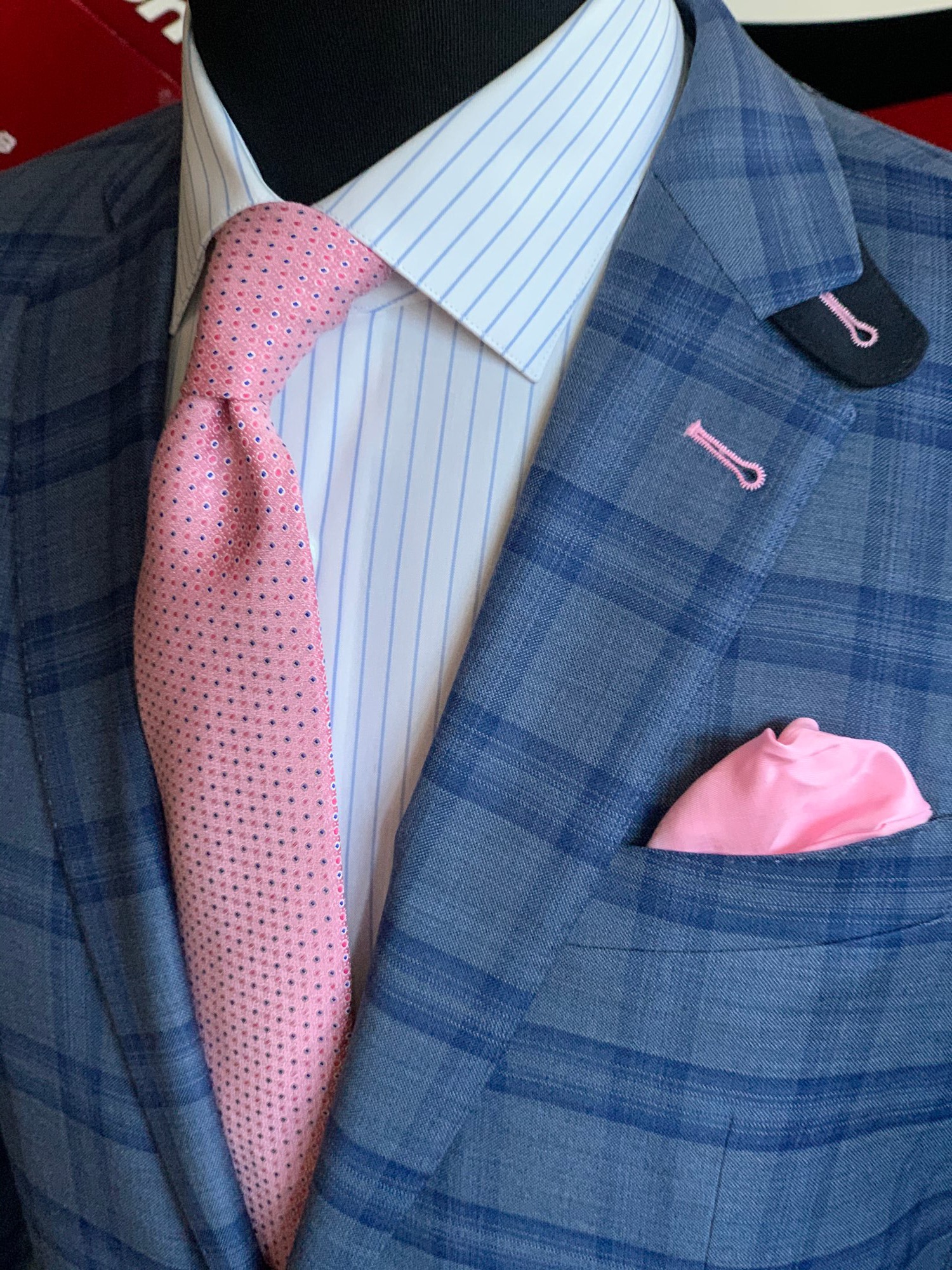 Blue plaid custom sport jacket with pink tie and pocket square showing professional Miami tailoring