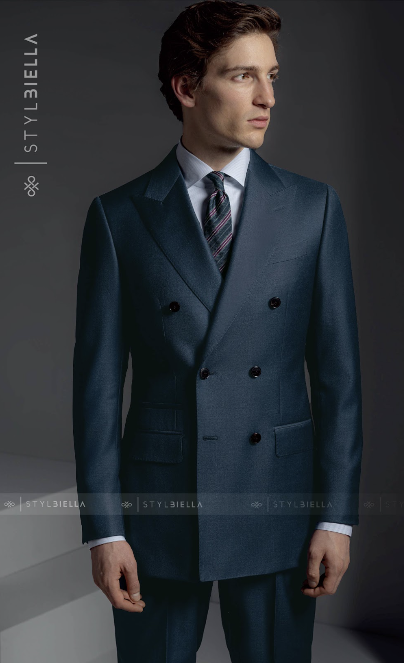 A teal double-breasted custom suit crafted by Bespoke By CB in Miami, demonstrating how the blue-green color works in a formal silhouette.
