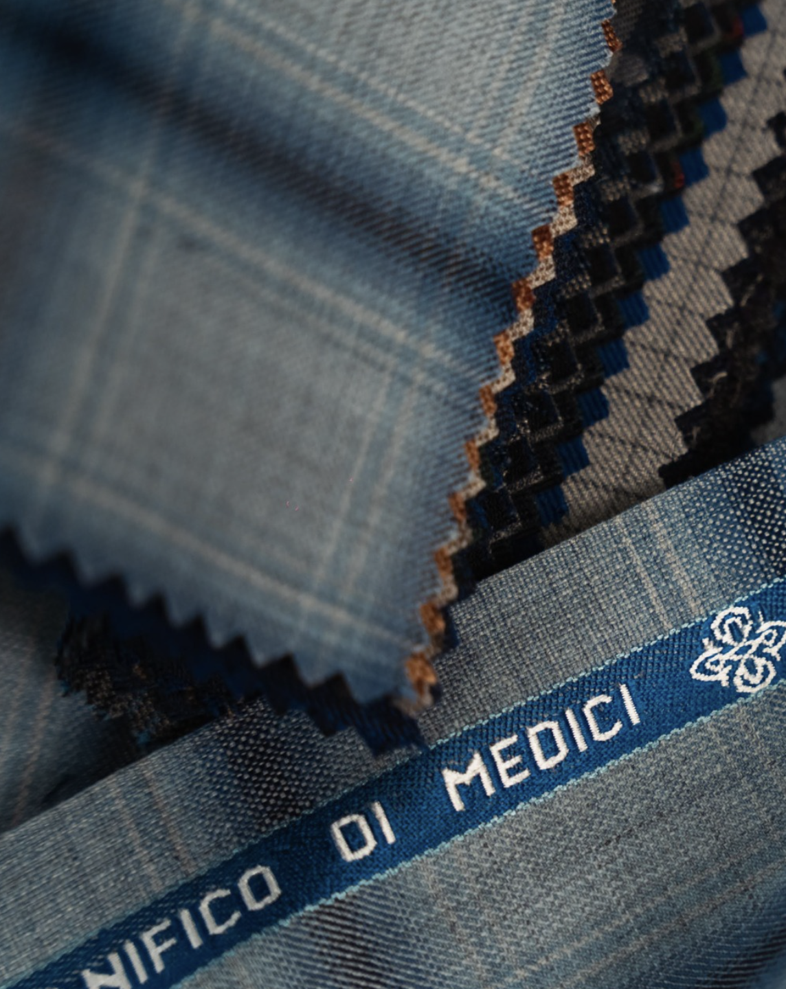 Medici blue plaid fabric swatch with Lanificio di Medici selvage edge