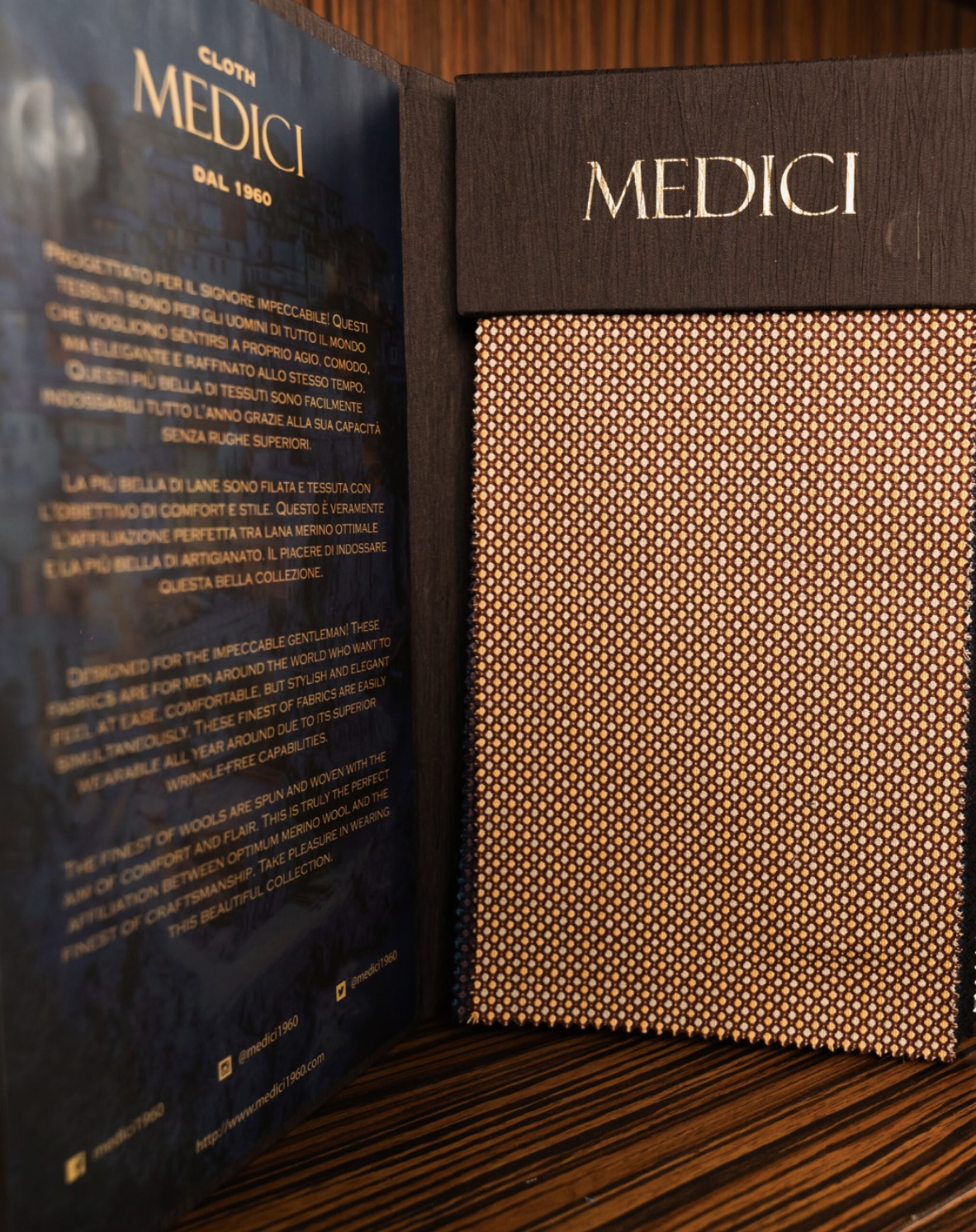 Medici open swatch book showing textured orange fabric and merino wool description