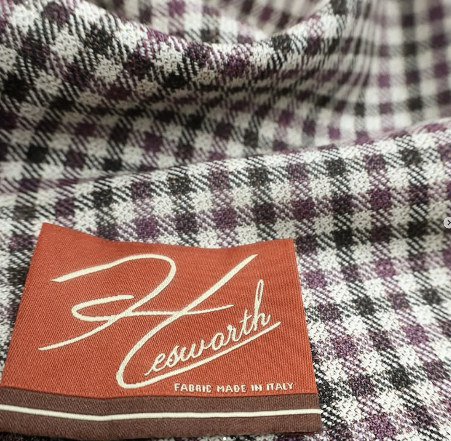 Hesworth plaid fabric swatch in purple, brown, and cream tones