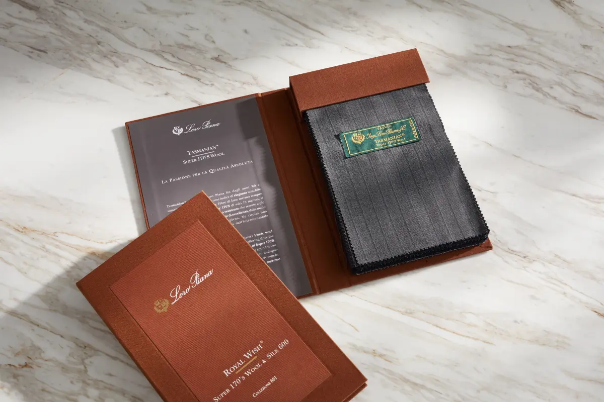 Loro Piana luxury fabric swatch books, premium wool selection at Bespoke By CB Miami
