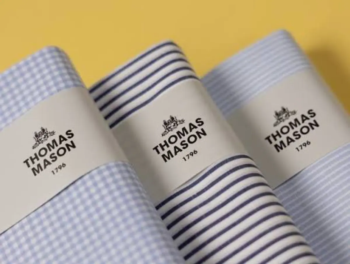 Thomas Mason fabric swatches showing the premium cotton and knit options for custom shirts.