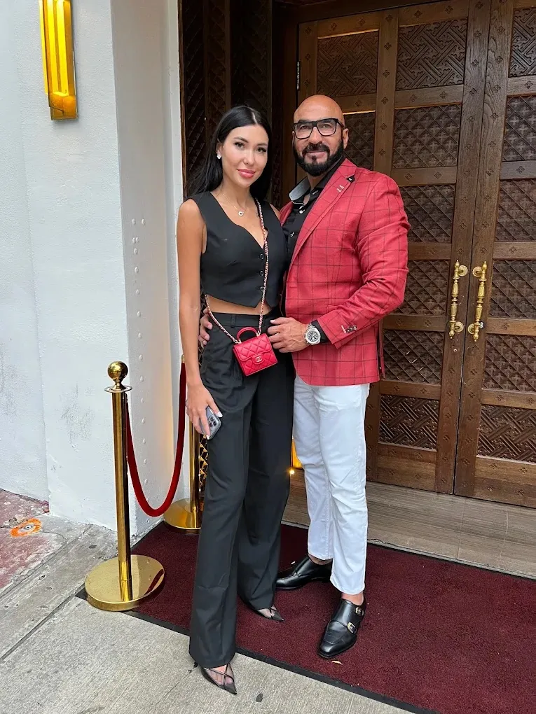 Raffi white short-sleeve button-down polo with beige trousers, a clean business casual look available at Bespoke By CB Miami