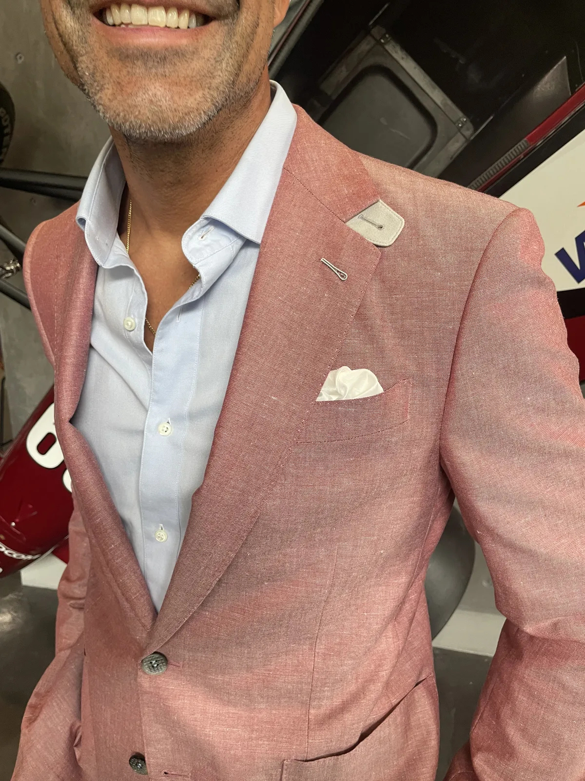 Salmon pink linen custom blazer on mannequin with white shirt and pocket square