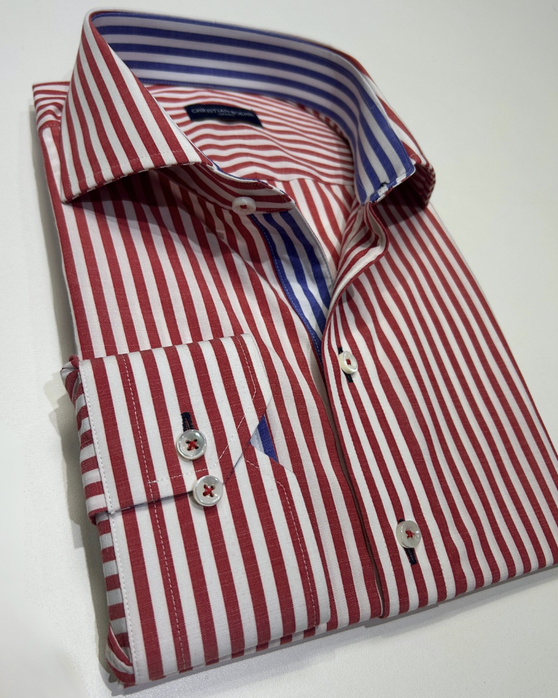 Red and white striped custom sport shirt folded to show the contrast cuff and inner collar detail.