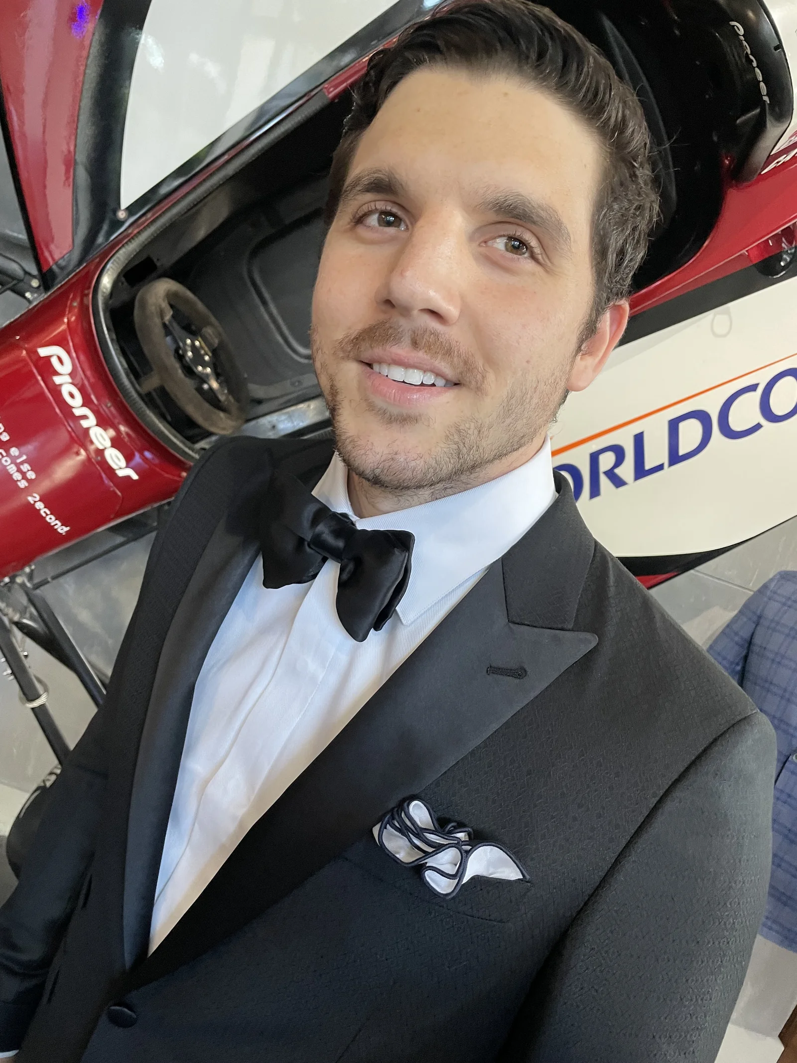Man wearing a formal custom tuxedo with black tie attire crafted by Bespoke By CB.