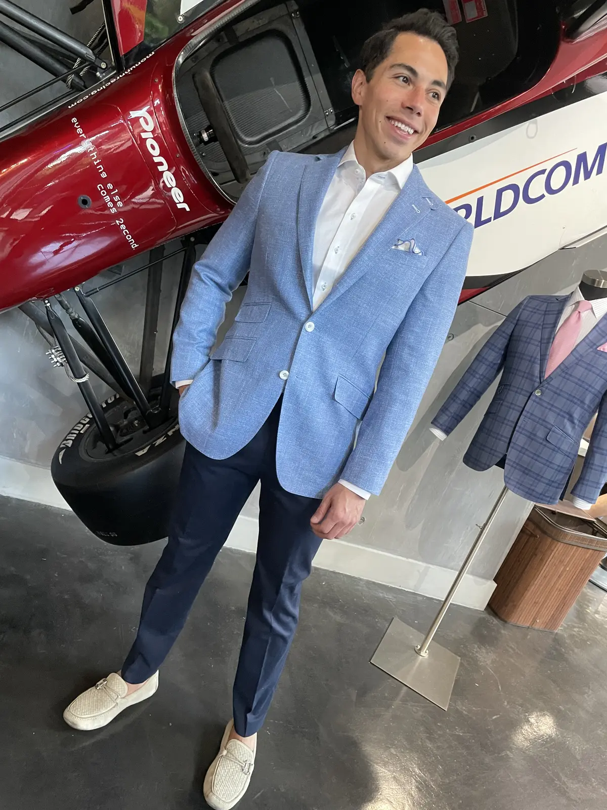 A light blue linen blazer with natural shoulder construction, ideal for Miami's warm weather business casual dress code