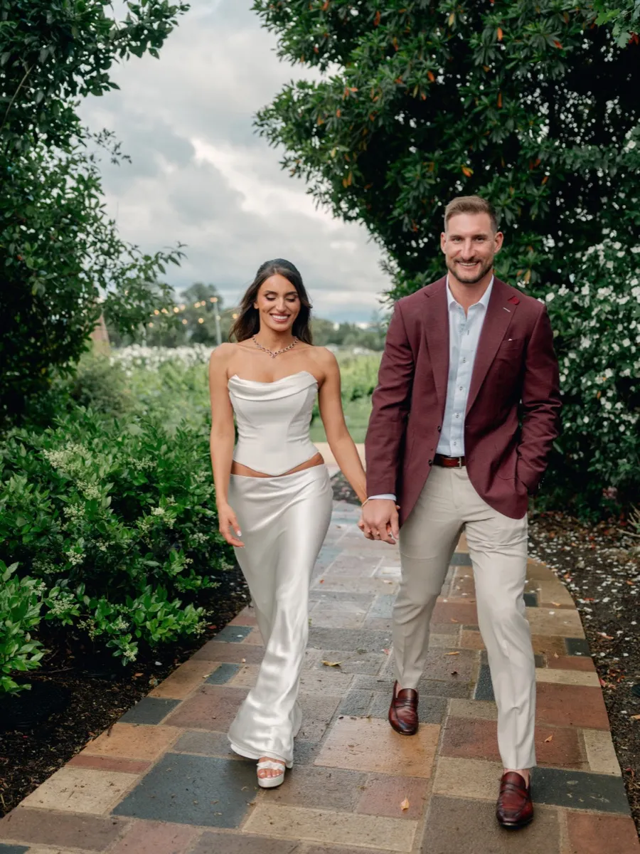 Joey Bosa in custom burgundy blazer at rehearsal dinner by Bespoke By CB